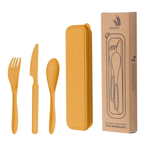 Portable wheat straw cutlery set including yellow knife, fork, and spoon with storage box