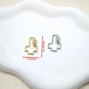 Macro view of gold and silver zircon screw clasps with measurements 25.4mm x 17.6mm
