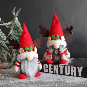 Christmas reindeer gnome doll with red hat and antler decor on a snowy holiday background