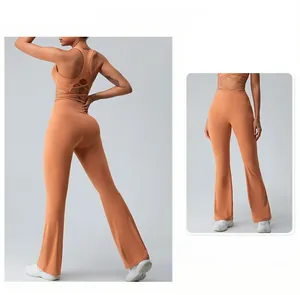 Detail of terracotta yoga set featuring cross-back sports bra and flared leggings