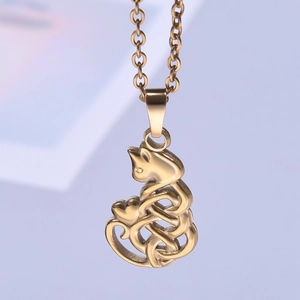 Macro shot of 18k gold-plated cat pendant with Celtic knot and heart charm on chain