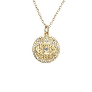Gold evil eye circle pendant necklace with micro-pave zircons on a white background