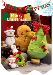 Plush Christmas plushies collection with Santa, Snowman, and Gingerbread man on a sofa