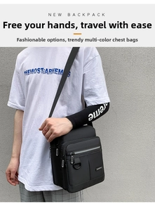 Close-up of waterproof black crossbody bag featuring front zipper and reflective safety strip