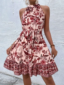 Detailed view of red floral halter neck dress with adjustable waist tie and floral patterns