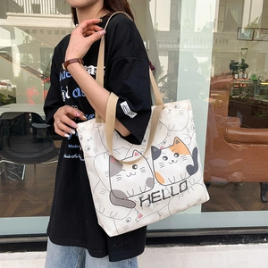 Large capacity canvas shoulder bag with cartoon cat print and HELLO lettering