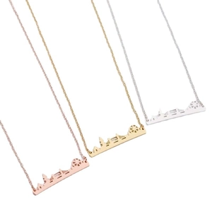 Three-piece skyline silhouette pendant necklace set in rose gold, gold, and silver finishes