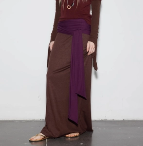 Detail of retro knit long skirt with brown patchwork and purple lace-up waist belt