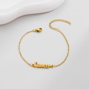 Detailed view of the gold Cancer zodiac letter bracelet with adjustable clasp
