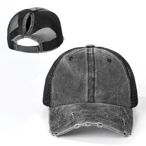 Detail of washed charcoal ponytail baseball cap with distressed brim and breathable mesh back