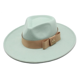 Chic mint green wool fedora hat with camel ribbon and golden bee ornament