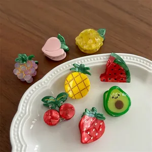 Colorful fruit-shaped acrylic hair clips featuring strawberry avocado and pineapple designs