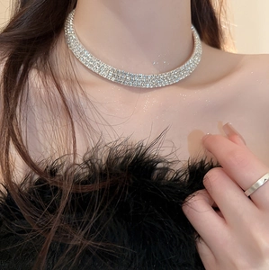Close-up of sparkling rhinestone choker necklace worn by model in French vintage style
