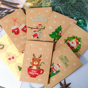 Detail of kraft paper Christmas envelopes and stickers with festive holiday patterns