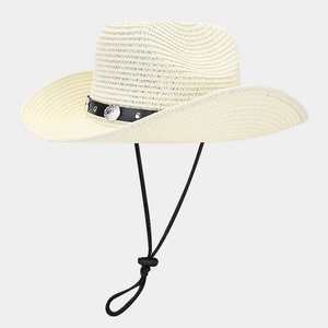 Detail of beige straw cowboy hat with studded leather band and adjustable chin strap