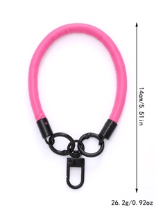 Short pink leather phone wrist strap with black metal clasp, size 14cm and 26.2g weight