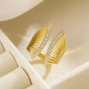 Minimalist gold-plated irregular geometric open ring featuring sparkling zircon wing design