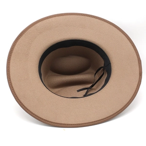 Detail of camel wool fedora hat interior with black sweatband and adjustable drawstring