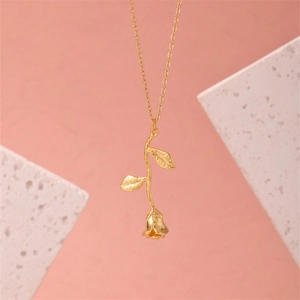 Elegant 3D golden rose pendant necklace with polished leaves on a minimalist chain