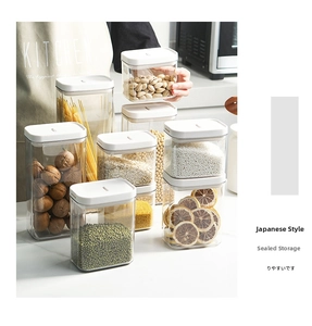 Close-up of airtight plastic food containers with white lids for pantry storage