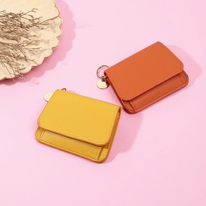 Litchi pattern leather short wallets in yellow and orange with metal keychains