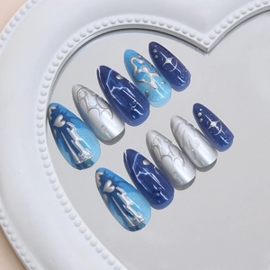 Blue cat-eye long almond press on nails with silver 3D lines and Y2K star designs