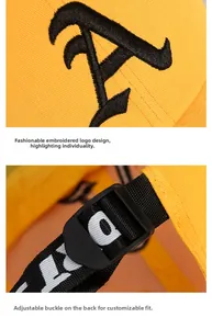 Detail view of adjustable back strap and buckle on yellow cotton baseball cap