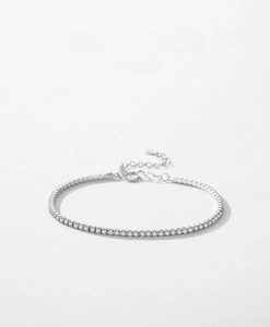 Macro detail of s925 sterling silver tennis bracelet with sparkling micro-pave crystals