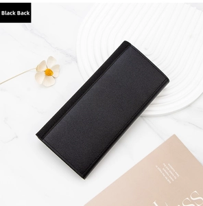 Rear view of black PU leather long wallet with fine texture on elegant marble background