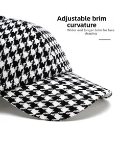 Detail of vintage houndstooth baseball cap with foldable wide brim for sun protection
