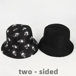 Reversible bucket hat with crown skull print and solid black outdoor sun protection