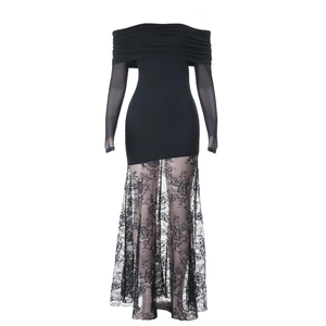 Detail of off-shoulder black slim dress featuring lace patchwork and knit fabric