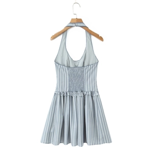Detailed view of the back elastic smocking and ruffle hem on striped halter dress