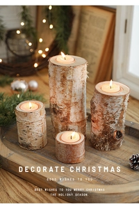Set of four natural birch wood candle holders in varying heights for Christmas decor