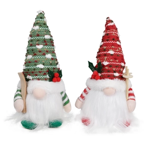 Set of two knitted Christmas gnomes with wooden skis and sequins for holiday decoration