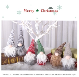 Set of six festive Christmas gnomes with knitted hats on white faux fur decoration