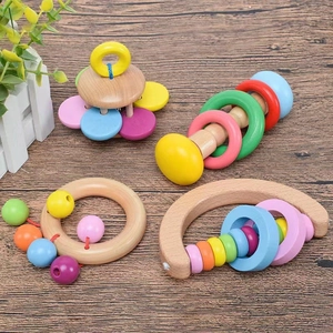 Montessori wooden rattle set with colorful beads and natural wood shapes for baby learning