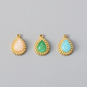 Detailed view of teardrop titanium steel pendants with pink green and blue natural stones