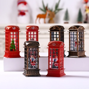 Close-up of a festive Christmas telephone booth water lantern with Santa inside