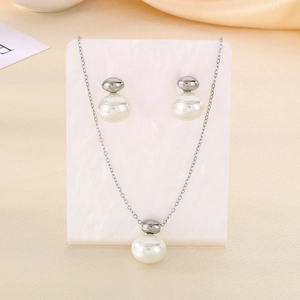 Elegant shell pearl jewelry set featuring silver necklace and matching stud earrings