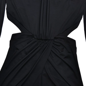 Detail of waist cut-out and ruched fabric on this black long sleeve dress