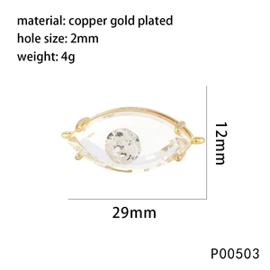 Macro detail of gold plated Evil Eye charm showing precise 29mm width and 12mm height dimensions