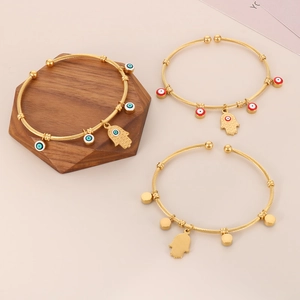 18K gold-plated stainless steel open wire bangles set with Evil Eye and Hamsa pendants