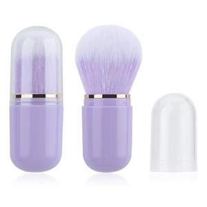 Portable lavender retractable makeup brush with a protective cap and compact capsule design