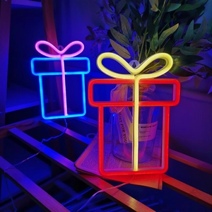 Gift box neon signs in pink and blue and red and yellow for cozy wall decor
