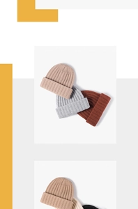 Detailed view of ribbed knit beanies showing thick texture and folded cuff design