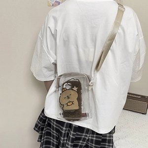 Transparent PVC crossbody bag with cartoon capybara plush interior and adjustable beige strap