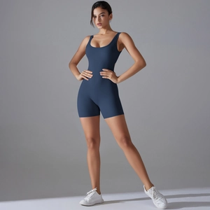 Close-up of deep blue high-stretch yoga romper with U-neck and peach-lift waist design