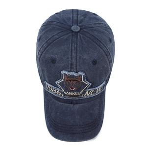 Washed navy blue denim baseball cap with vintage wolf embroidery and 1986 patch