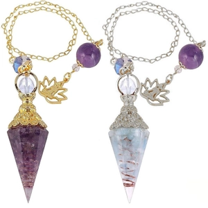 Detail view of two resin crystal pendulums in gold and silver finish with lotus charms